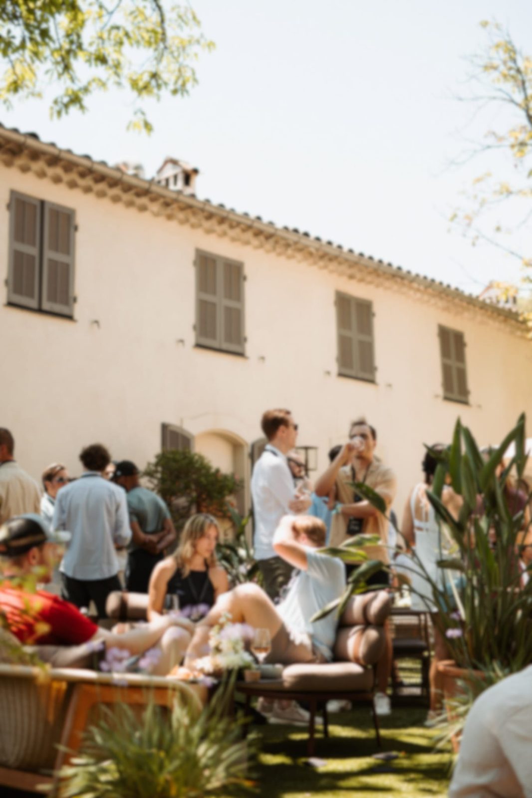 Guests at a Mesh event in a Cannes courtyard
